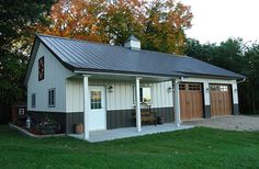 a garage with two doors and a porch