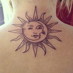 a sun and moon tattoo on the back of a woman's upper back neck