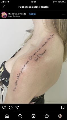 the back of a woman's shoulder with writing on it