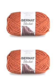 two skeins of yarn in orange and brown colors, with the words bernat on