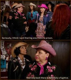 two women in cowboy hats talking to each other and one is wearing a pink hat