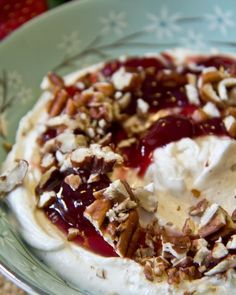 a bowl filled with ice cream and nuts