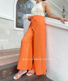 - Original Jepun Warp Pants - Made of Soft Cotton, Rayon, Lightweight ITEMS DESCRIPTION : A smooth moving and comfortable yet stylish culottes for women! Our collection is homemade and tailored with love and care to the details by our local tailors. This is made especially for summer wear collection as it is made from high quality rayon material in orange color which is breathable, refreshing, soft and super comfortable. This pant has added side cleavage to provide more free movement space for y High Waist Capris With Elastic Waistband For Summer, Beach Capris With Elastic Waistband, Loosely Fitted Vacation Yoga Pants, Summer Vacation Capris With Elastic Waistband, Cotton Wide Leg Bottoms For Beach Season, Cotton Wide-leg Pants For Beach Season, Wide Leg Cotton Bottoms For Beach Season, High Waist Harem Pants For Summer Yoga, Cotton Straight Pants For Beach Season