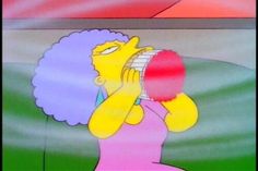 the simpsons character is drinking from a glass in front of an image of a woman