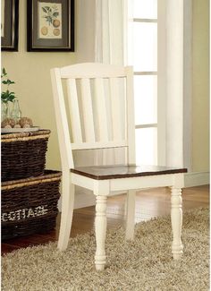 a white chair sitting on top of a wooden floor