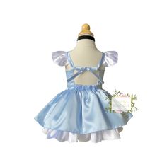 My Cinderella take without the extra itchy stuff! This sweet sky blue dress is so soft and buttery, your child with always be comfortable. The skirt is vintage length with built-in layers for a little poof. The straps adjust for an easy fit. So classic and fun! Necklace is not included. Matching sky blue bows and bloomers in the accessory collection of my shop. ***Please measure your child before selecting a size*** I will make the dress according to these measurements if personal measurements a Fitted Light Blue Princess Dress For Spring, Cute Sleeveless Light Blue Princess Dress, Blue Balletcore Dresses For Summer, Blue Summer Dresses In Balletcore Style, Blue Balletcore Summer Dresses, Cute Light Blue Princess Dress With Ruffles, Spring Light Blue Princess Dress With Ruffles, Fitted Light Blue Princess Dress For Summer, Light Blue Fitted Princess Dress For Summer