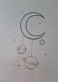 a drawing of the moon and planets hanging from strings