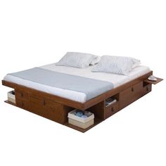 a bed with two drawers underneath it and white sheets on the headboard, in front of a white background