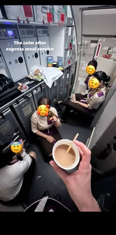 some people are sitting in an airplane and drinking coffee with emoticions on their faces