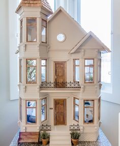 a doll house sitting on top of a table