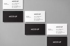 four business cards with the word mockup printed on them, all in black and white