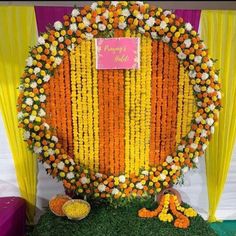 an arrangement of flowers and garlands on display at a wedding ceremony in india with the name haldi ceremony decoration baba event