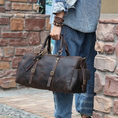 Easy to pack,holds a lot,stylish to carry.Woosir’s black leather travel duffle bag has what it takes to be the only travel bag you’ll need.This leather travel bag offers plenty of room to hold what you need for an overnight trip or a 3-day adventure.     ITEM OVERVIEW   Size: 52.5 x 25 x 25.5cm(L x W x H), attached with a long strap with adjustable length, the size is perfect for a long or short-trip.    Made from high-quality genuine leather, smooth zip, strong stitching, polished hard work, safe, strong, durable, zip closure, belonging to a small bag.    Its capacity exceeds your imagination and can accommodate a wide range of daily necessities, making it practical and convenient. Hand-held thickening and decompression design reduces stress on the hand and makes it easier to carry out Large Capacity Leather Duffle Bag For Trips, Soft Leather Satchel For Weekend Trips, Soft Leather Travel Bag For Trips, Soft Leather Satchel Travel Bag For Trips, Soft Leather Satchel Duffle Bag For Travel, Soft Leather Tote Travel Bag For Trips, Soft Leather Travel Tote Bag, Soft Leather Travel Tote Bag For Trips, Leather Shoulder Travel Bag