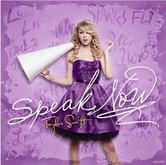 a woman in a purple dress holding a white megaphone with the words speak now on it