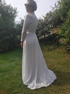 "Vintage 70s wedding gown. Long sleeve lace wedding dress. Stand up collar, front buttoned up, two layers. Seems like home made or tailored. S/M size. From shoulder to shoulder 16\" 41cm Bust 34\" 86cm Waist 28\" 71cm Sleeve length 20\" 51cm Length in front 59\" back 61\"" Modest Fitted Maxi Dress For Wedding, Modest Fitted Lace Maxi Dress, Fitted Maxi Dress With Scalloped Lace For Wedding, Long Sleeve Maxi Dress With Lace Trim For Wedding, Full-length Lace Maxi Dress For Wedding, Vintage Full-length Wedding Maxi Dress, White Long Sleeve Vintage Wedding Dress, Vintage Long Sleeve Maxi Dress For Wedding, Vintage Full-length Maxi Dress For Wedding