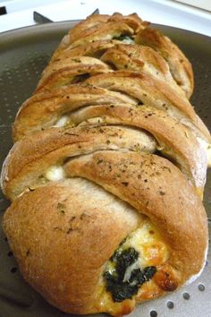 some bread with spinach and cheese on it