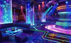 a brightly lit room with couches and tables in front of colorful lights on the walls