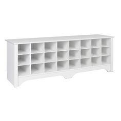 a white bookcase with many compartments on the top and bottom shelves in different sizes