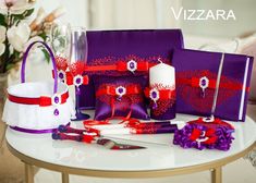 a table topped with purple and red items