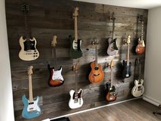 a wall with guitars hanging on it