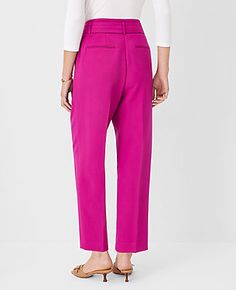 Elevate your wardrobe with the sophisticated charm of Ann Taylor's Belted Taper Pants in Magenta Shadow. These pants are designed to flatter with a high-rise, belted waist and a sleek tapered leg that narrows at the ankle, ensuring a polished silhouette.

- Size: 6 Regular
- Color: Magenta Shadow
- Material: 79% Polyester, 17% Rayon, 4% Spandex
- Gender: Female
- Fit: Tailored and fitted
- Rise: High rise
- Length: Hits at ankle; 27" inseam with 15 1/2" leg opening
- Features: Front zip with dou Spring Tapered Pants With Belt Loops, Taper Pants, Color Magenta, Tapered Pants, Waist Length, Slim Legs, Modern Woman, Effortless Style, Ann Taylor