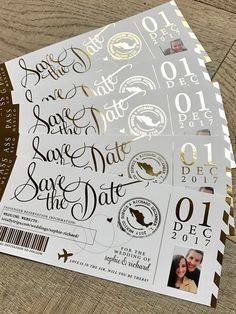 some white and gold stickers are on top of each other, with the words save the date printed on them