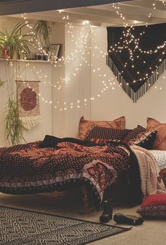 a bed room with a neatly made bed and lots of lights