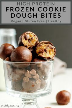 a glass bowl filled with chocolate candies and nuts