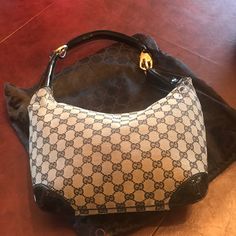 Absolutely Authentic Gucci Black And Grey Gucci Hobo Bag With Patent Leather Handle And Corners. Purchased In Naples Italy In 2003. This Style Is Rare And I Have Never Really Seen Anyone Else With It. There Is A Small Scrape In The Canvas (See Photo) On On Side Approx 3.5” Long By 1/2” Wide. I Am Not Sure How That Happened. Other Than That The Bag Is In Very Good Condition And Interior Is Mint. Comes With Dustbag. Elegant Pre-owned Tote Shoulder Bag, Black Gucci Monogram Canvas Shoulder Bag, Pre-owned Elegant Top Handle Bag, Elegant Pre-owned Top Handle Bag, Designer Pre-owned Monogram Canvas Shoulder Bag, Designer Monogram Canvas Shoulder Bag, Designer Monogram Canvas Pre-owned Shoulder Bag, Elegant Pre-owned Shoulder Bag, Elegant Gucci Monogram Canvas Bag