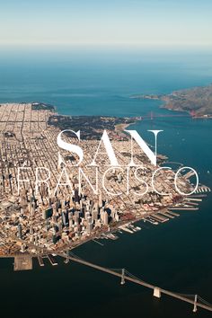 an aerial view of a large city next to the ocean