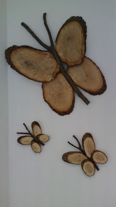 three pieces of wood cut in half to look like butterflies