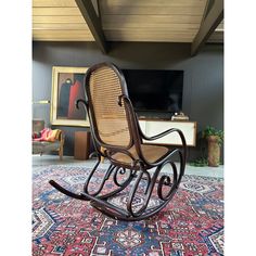 a rocking chair sitting on top of a rug