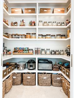 an organized pantry with baskets and food items