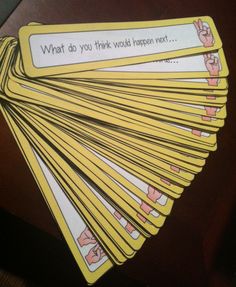 a bunch of cards that are on top of a wooden table, with the words what do you think would happen next?