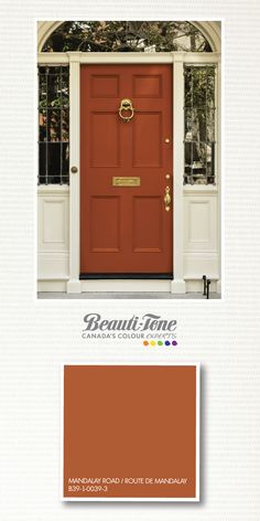 an orange front door with the words beautitone canada painted on it and below