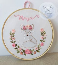 a embroidery project with a fox and flowers in the hoop that says, maga