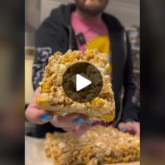 a person holding food in their hands with the video showing it's close up