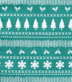 a green and white christmas sweater with trees on it