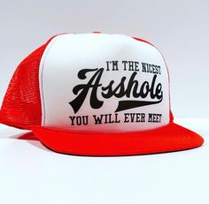 a red and white trucker hat that says i'm the nicest ashhole you will ever meet