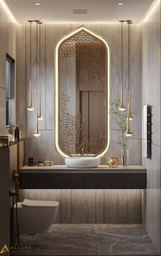 a bathroom with a sink, mirror and lights on the wall next to the toilet