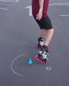 a man riding a skateboard on top of a parking lot