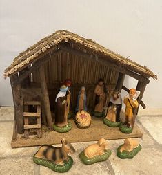 a nativity scene with figurines in the form of animals