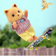 a teddy bear flying through the air with a skateboard in front of it,