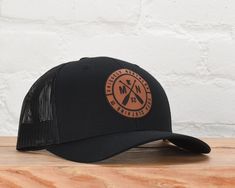 Our Onyx Snapback is a true customer favorite and this seasons must have item. It's a classic black snapback with a leather patch featuring our iconic MN paddle logo in black with the state silhouette and the number 32, a subtle nod to Minnesota being the 32nd state to join the Union. - 60% Cotton 40% Polyester - Snapback - One size fits most - Spot clean - Imported Retail: $30 *Prolonged exposure to sunlight may bleach the fabric. Spot clean for sweat stains. Sweat Stains, Black Snapback, The Union, Must Have Items, Leather Patches, Womens Tank, Classic Black, Minnesota, Onyx