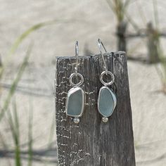 The Sea Foam Blue sea glass used in these earrings were found in Hawaii. As you can see, no two pieces of sea glass are the same. That is what makes these earrings so unique. Fine Silver and Sterling Silver was used to create these hand crafted pieces. French hook earring wire and tiny silver balls embellish these dangle earrings. Photos are taken outside in sunlight and shaded areas to show the way the light shines differently on the sea glass. Silver Recycled Glass Beach Earrings, Silver Sea Glass Earrings For Beach, Handmade Sea Glass Green Earrings, Silver Sea Glass Drop Earrings, Sea Foam Blue, Nickel-free Blue Sea Glass Earrings, French Hook Earrings, Earring Wire, Sea Glass Earrings