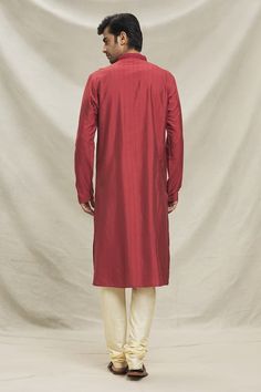 Red kurta with placket embroidery. Paired with a beige pyjama. - Aza Fashions Red Unstitched Kurta With Naqshi Detail, Red Unstitched Kurta With Naqshi, Red Kurta With Naqshi In Traditional Drape, Red Naqshi Kurta With Traditional Drape, Red Traditional Churidar With Naqshi Details, Red Long Sleeve Kurta For Traditional Ceremonies, Red Straight Kurta For Traditional Ceremonies, Red Straight Kurta With Naqshi Detailing, Red Straight Kurta With Naqshi