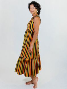 Our soft and stretchy organic cotton jersey is the perfect fabric for this midi dress. With bold stripes, a chic tiered hem, and feel-good wide straps, it's a dress that can go all day and carry you right into the evening. 95% Organic Cotton 5% Spandex Length of size M is 42" from top of bodice Made fair trade in India by one of our longstanding production partners Striped Cotton Maxi Sundress, Striped Cotton Midi Dress Knee-length, Opal Dress, Bold Stripes, Wide Straps, Fair Trade, Bodice, Opal, Organic Cotton