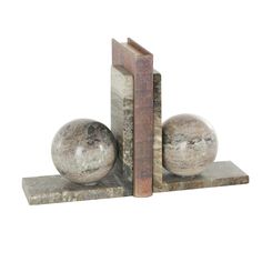 two bookends with marble balls on them