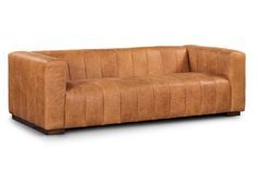 a brown leather couch sitting on top of a white floor