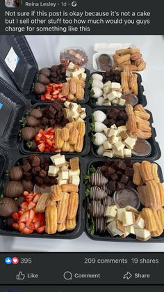 a table topped with lots of trays filled with different types of foods and desserts